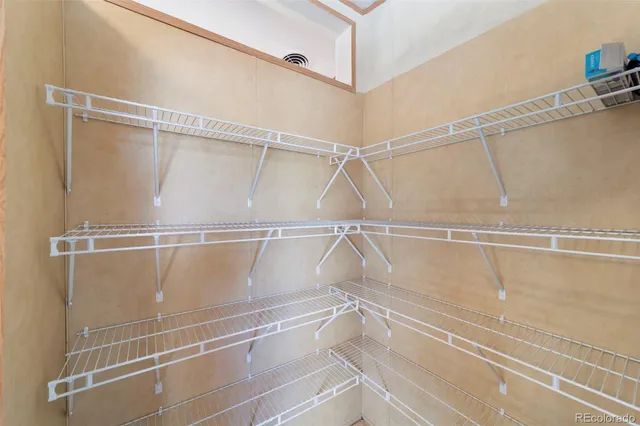 a view of a room with racks on the wall