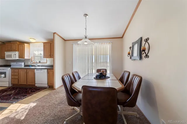 a view of a dining room with furniture window and outside view