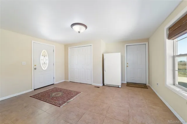 a view of an empty room and window