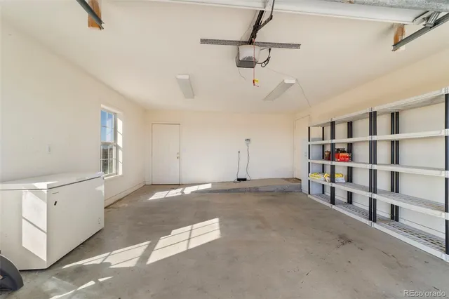 a view of an empty room with shelves