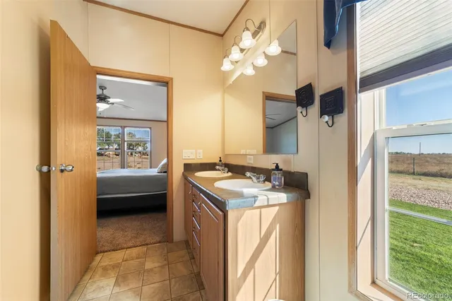 a bathroom with a sink a vanity and a mirror