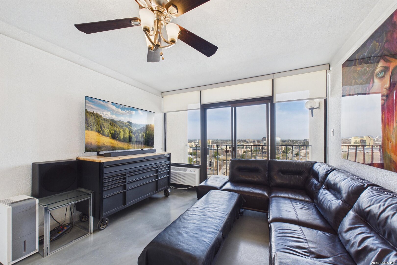 7701 Wurzbach Road, Unit 1803 San Antonio, TX 78229 - Photo 11 of 34 a living room with furniture and a large window