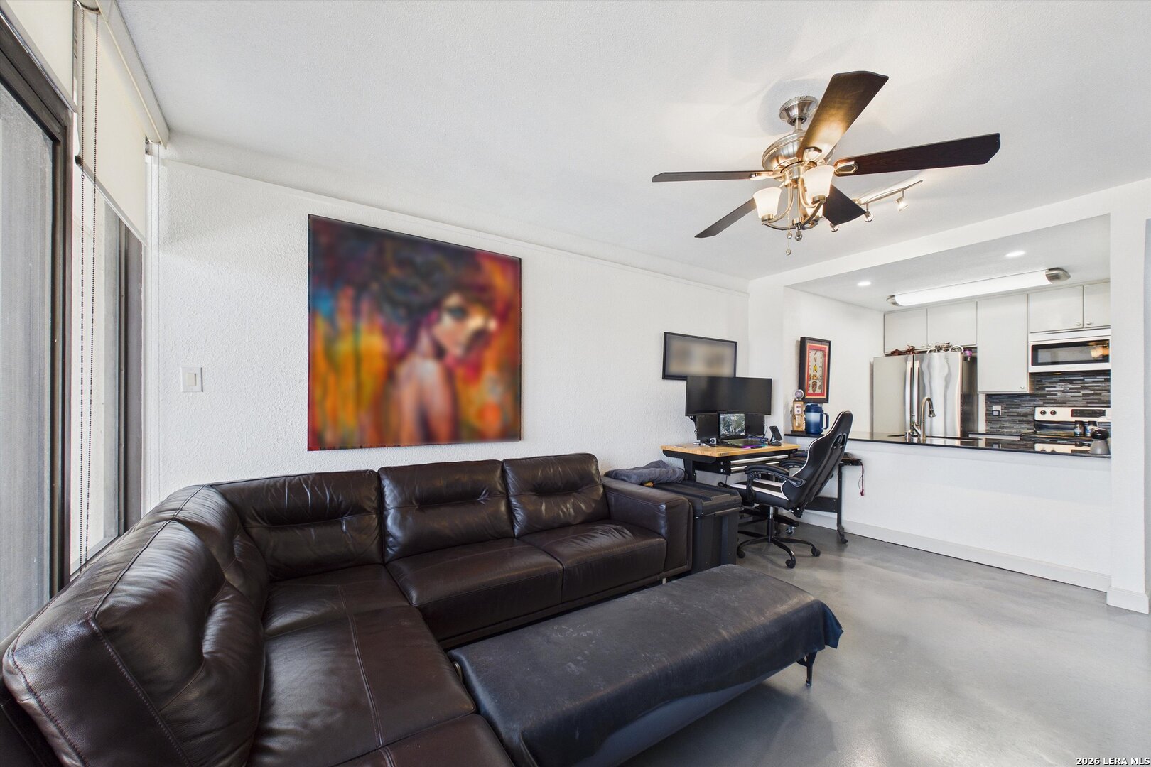 7701 Wurzbach Road, Unit 1803 San Antonio, TX 78229 - Photo 12 of 34 a living room with furniture