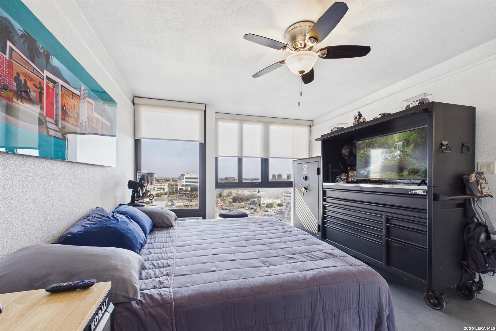 7701 Wurzbach Road, Unit 1803 San Antonio, TX 78229 - Photo 19 of 34 a bedroom with a bed and a flat screen tv