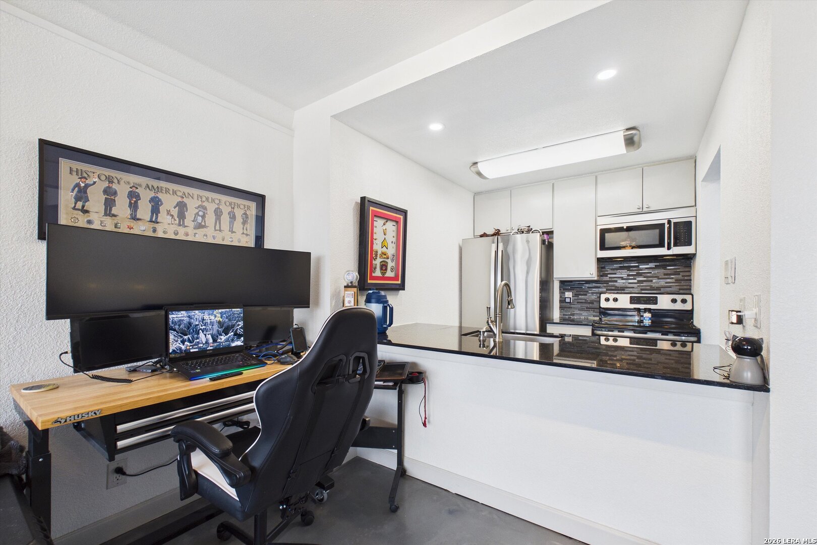 7701 Wurzbach Road, Unit 1803 San Antonio, TX 78229 - Photo 8 of 34 a view of kitchen with furniture and a refrigerator