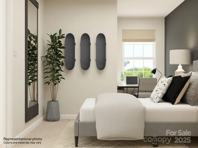 a bedroom with a bed and lamp