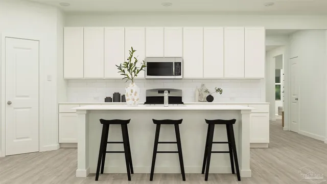 a view of kitchen with cabinets and wooden floor