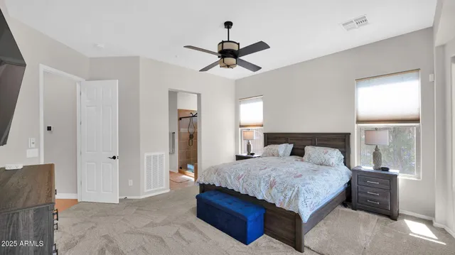 a spacious bathroom with a granite countertop sink mirror and a bathtub with shower