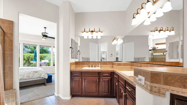 a front view of a house with outdoor seating and a garden