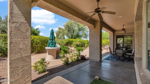 a view of a table and chairs in patio of the house