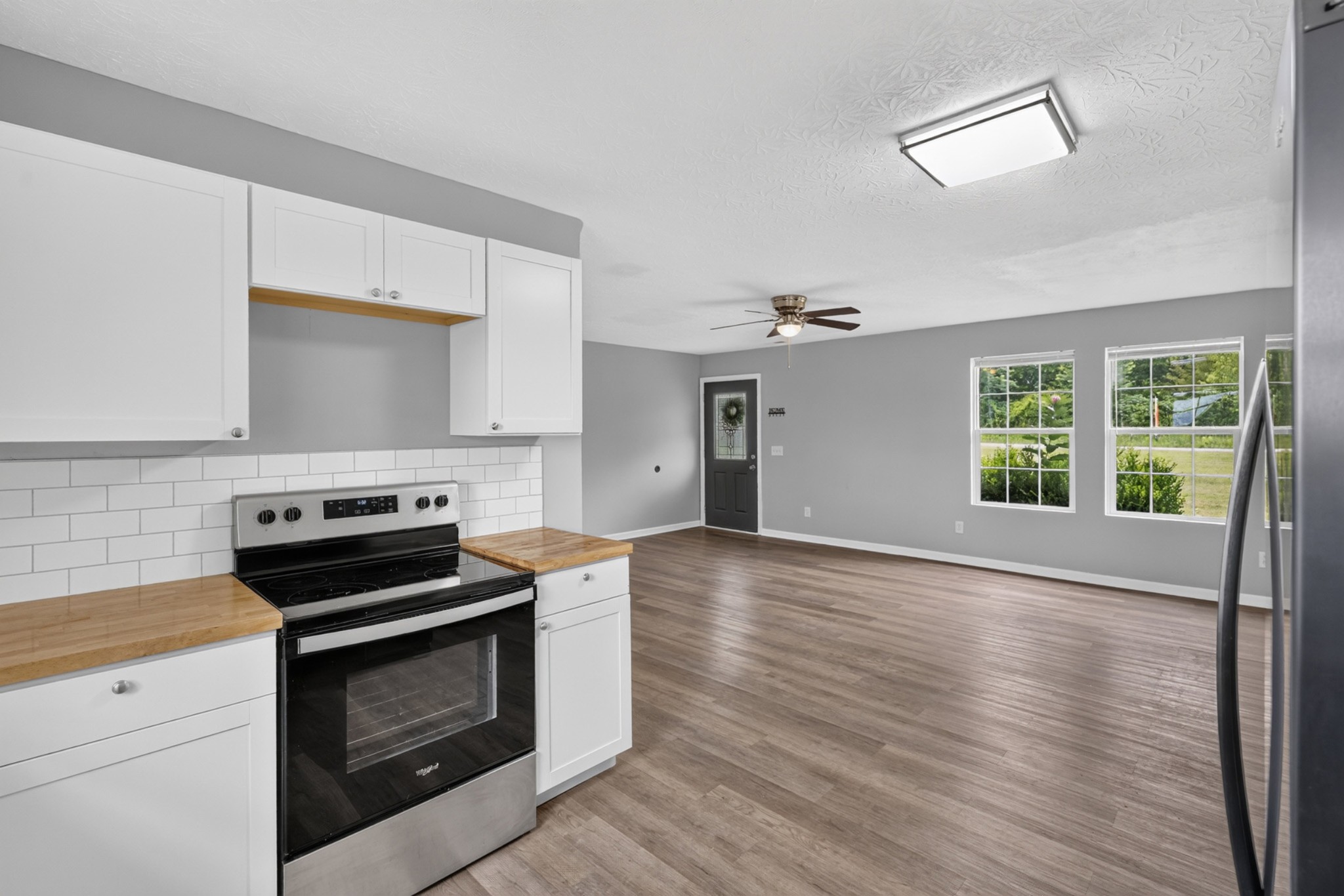 120 Driver Road Lafayette, TN 37083 - Photo 13 of 39 a kitchen with wooden floors and a stove top oven