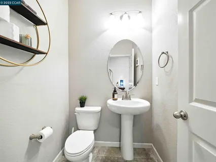 a view of a hallway with wooden floor and entryway