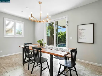 a living room with a fireplace and a flat screen tv