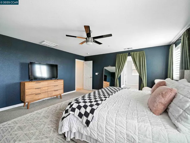 a bathroom with a glass shower door and a glass door