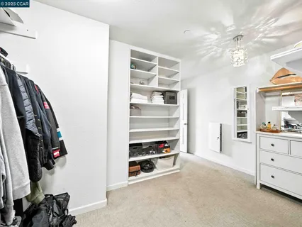 a view of a patio with table and chairs and potted plants