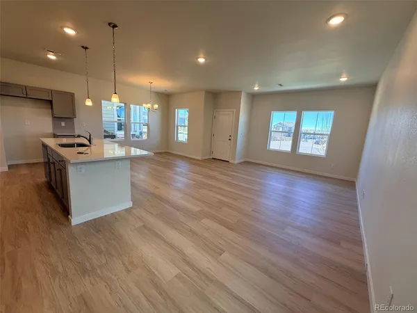 a view of kitchen with cabinets and wooden floor