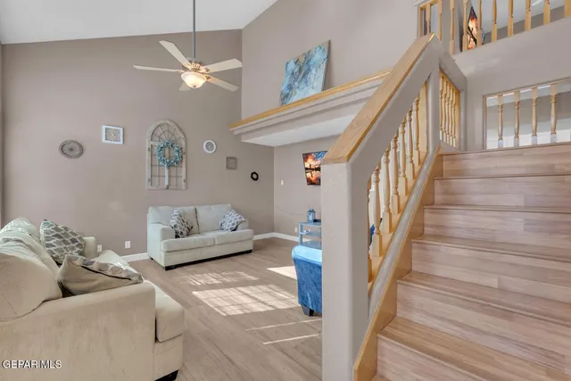 a living room with furniture and a rug