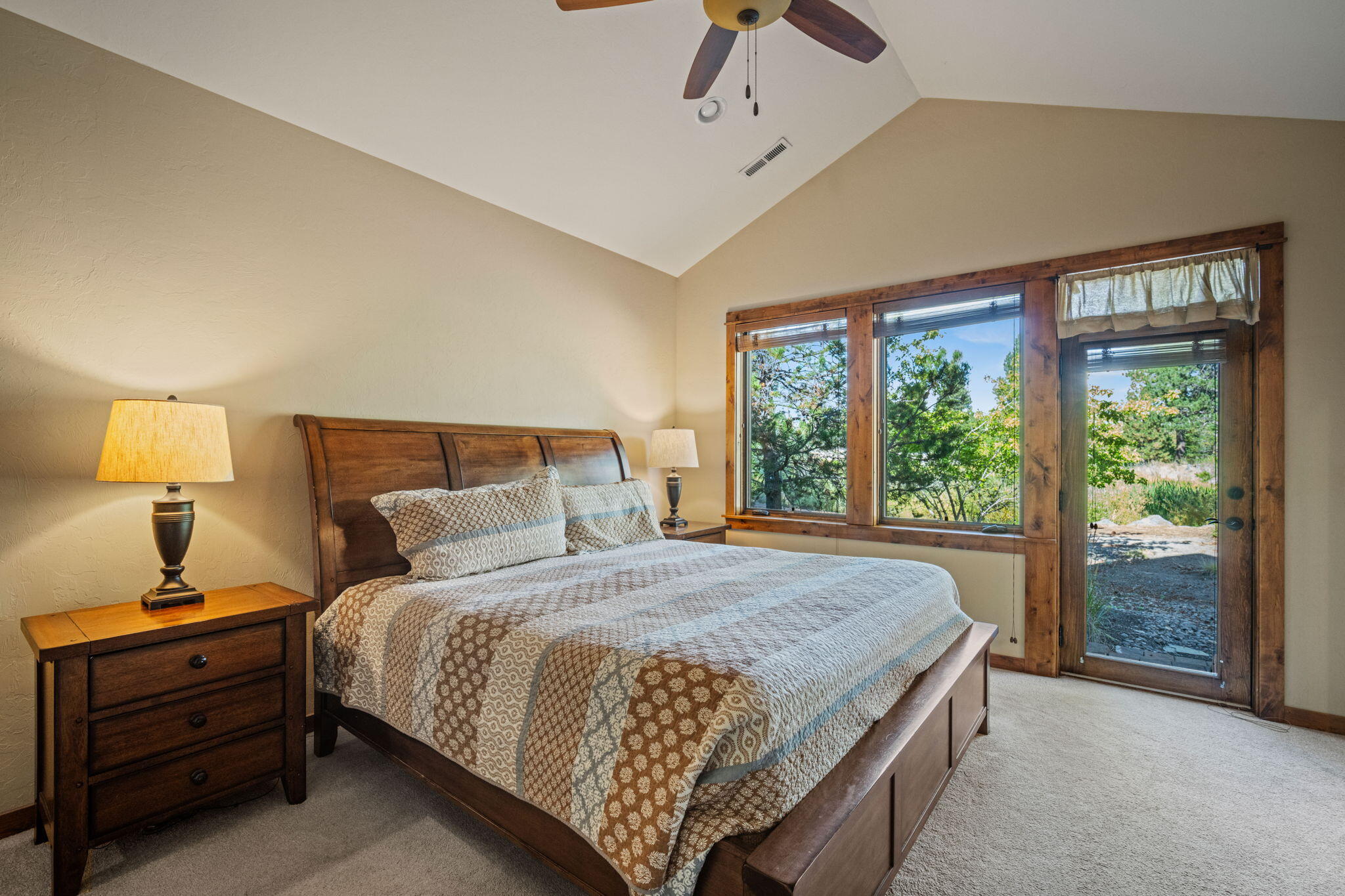 56508 Dancing Rock Loop, Unit 22 Bend, OR 97707 - Photo 27 of 69 a bedroom with a bed lamp and window
