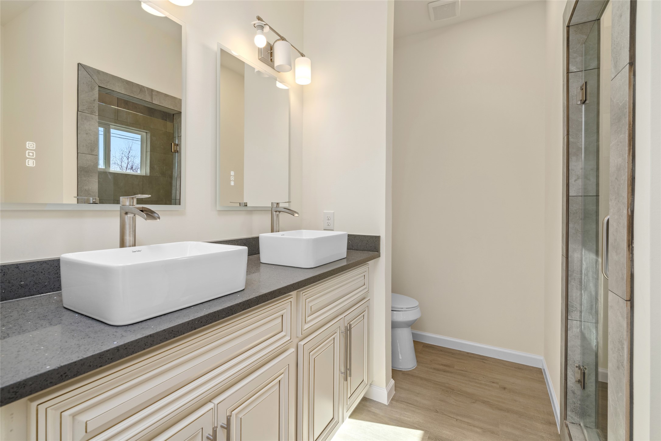 4656 North Teague Street Rosharon, TX 77583 - Photo 28 of 41 Modern vanity with sleek countertop, vessel sink, and stylish lighting.