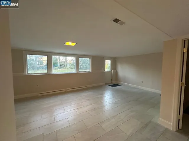 a view of room with gym equipment