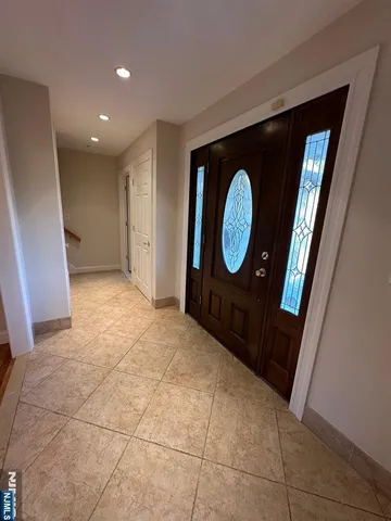 a view of a livingroom with a furniture and a mirror