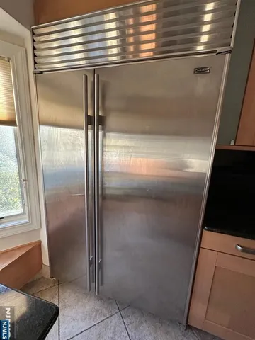 a stove top oven sitting inside of a kitchen