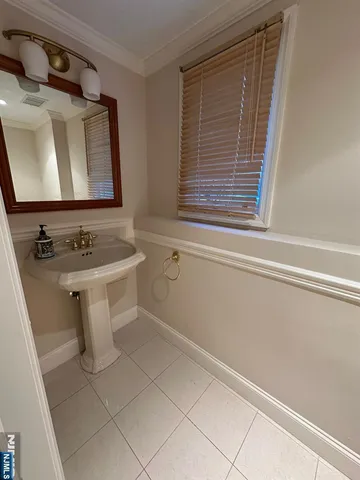 a bathroom with a sink a vanity and a toilet
