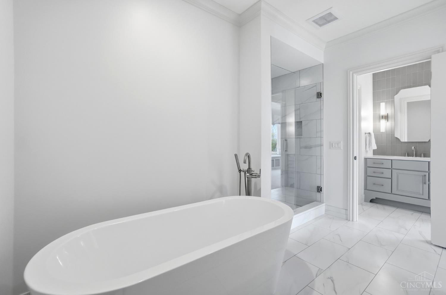 4535 Drake Road Cincinnati, OH 45243 - Photo 44 of 96 This full bathroom on the second floor has a shower, soaking tub and separate vanities.