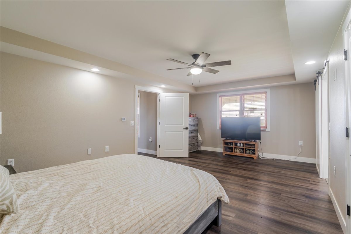 1388 East 2950 North Road Mansfield, IL 61854 - Photo 18 of 43 a spacious bedroom with a bed and a chair