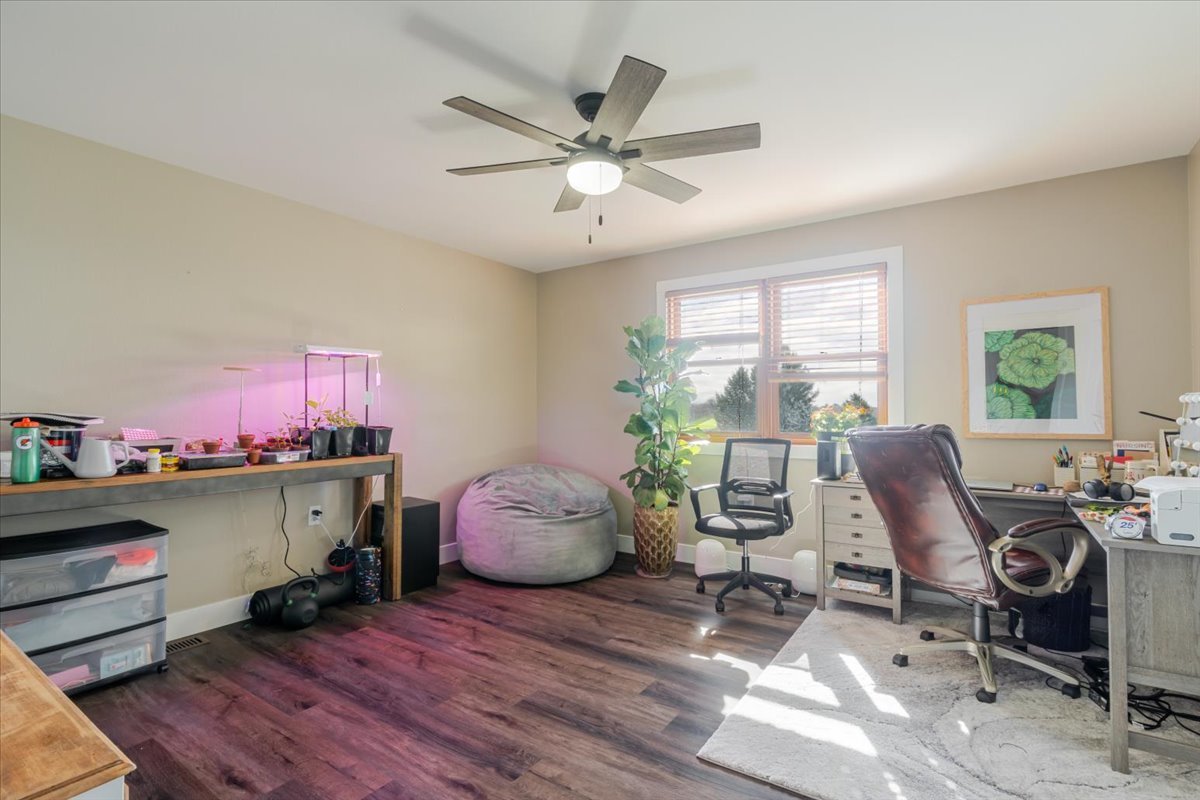1388 East 2950 North Road Mansfield, IL 61854 - Photo 20 of 43 a workspace with furniture window and wooden floor