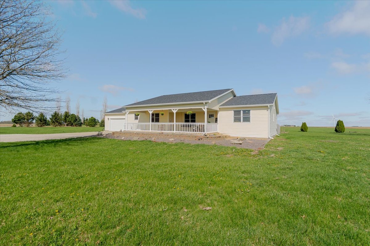 1388 East 2950 North Road Mansfield, IL 61854 - Photo 2 of 43 a aerial view of a house with a yard table and chairs