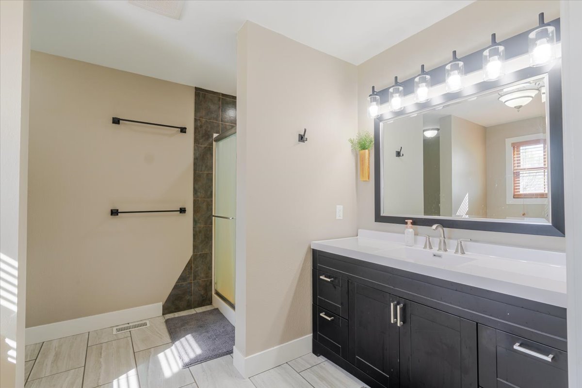 1388 East 2950 North Road Mansfield, IL 61854 - Photo 21 of 43 a bathroom with a double vanity sink mirror and toilet