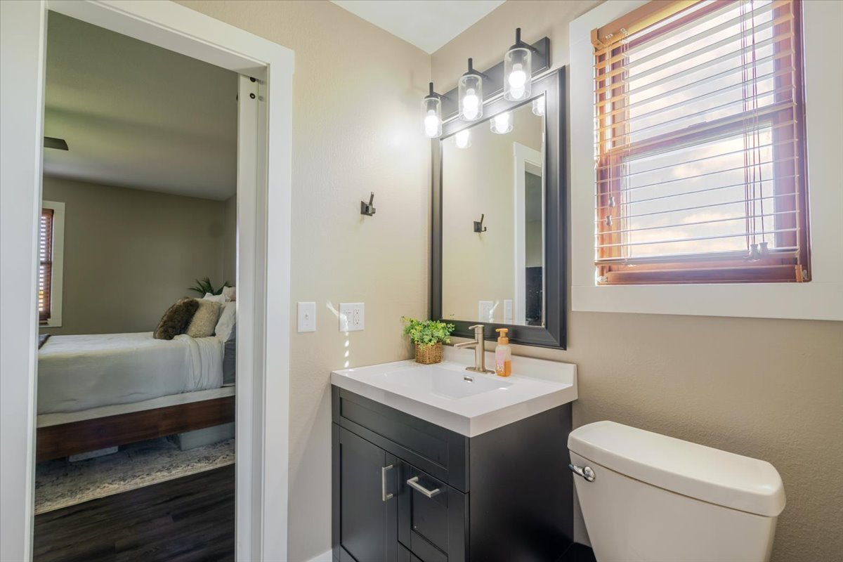 1388 East 2950 North Road Mansfield, IL 61854 - Photo 24 of 43 a bathroom with a sink a toilet and shower