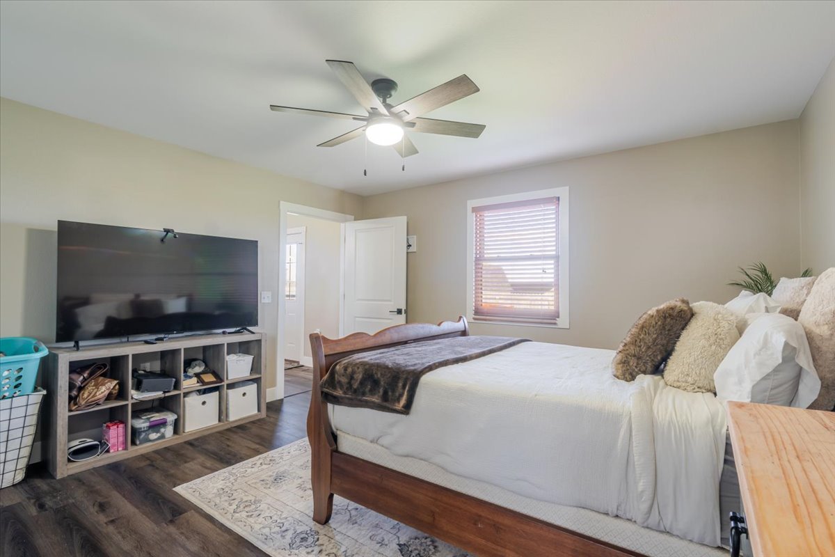 1388 East 2950 North Road Mansfield, IL 61854 - Photo 26 of 43 a bedroom with a bed and a flat screen tv