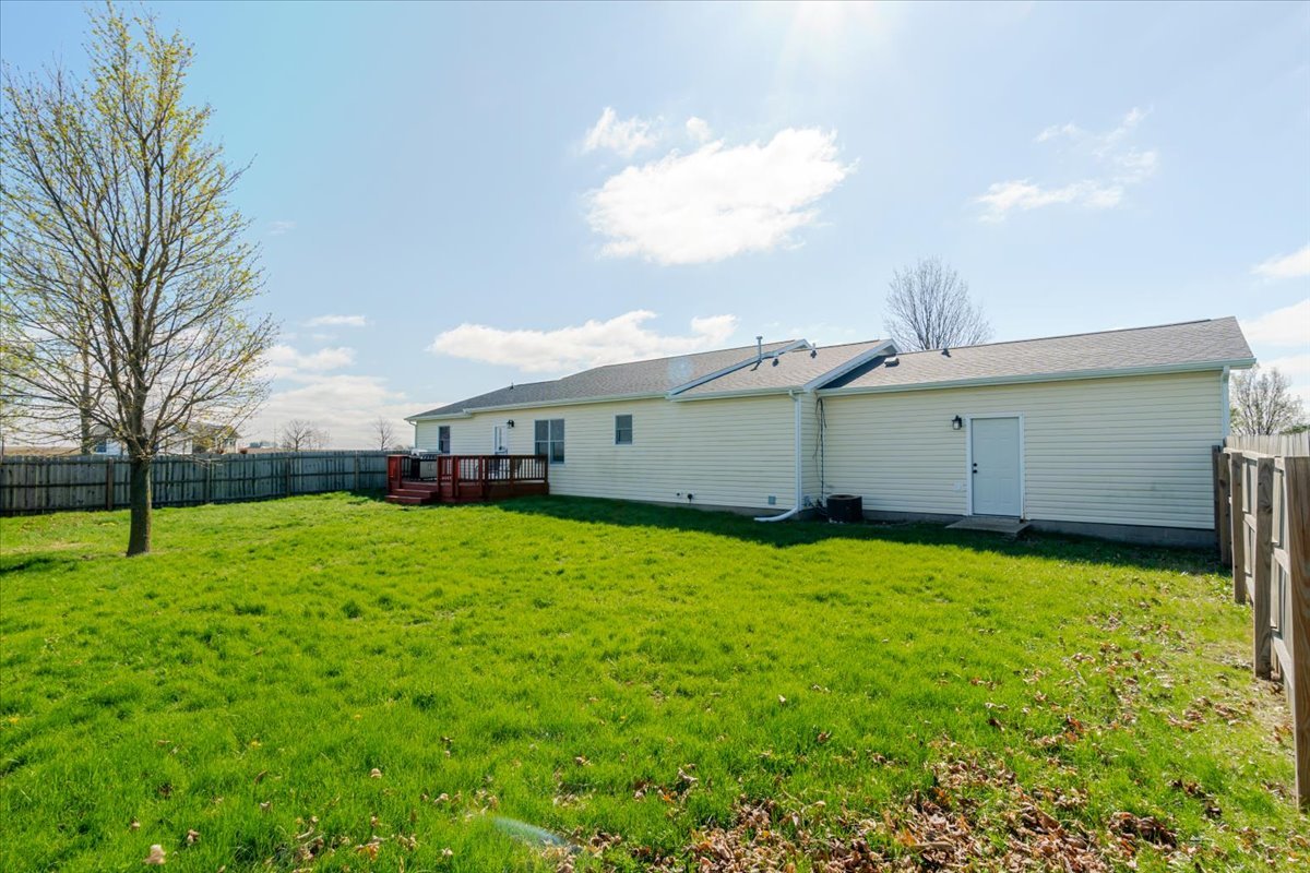 1388 East 2950 North Road Mansfield, IL 61854 - Photo 27 of 43 a front view of a house with a yard and garage