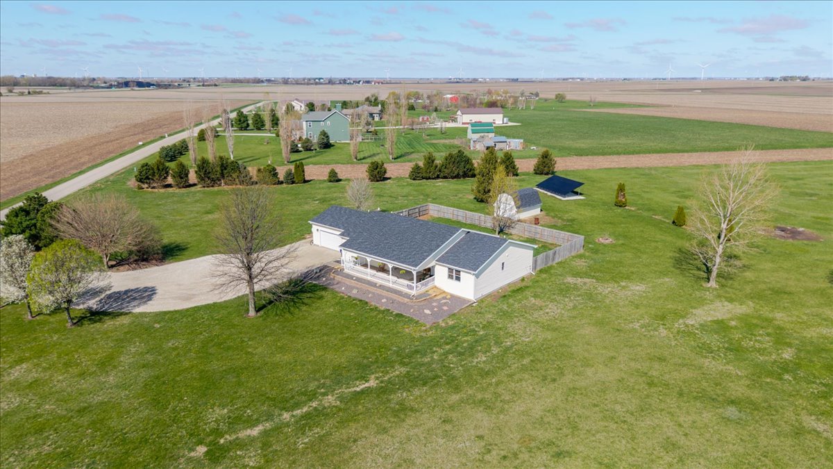1388 East 2950 North Road Mansfield, IL 61854 - Photo 40 of 43 a view of a lake with a yard and large trees