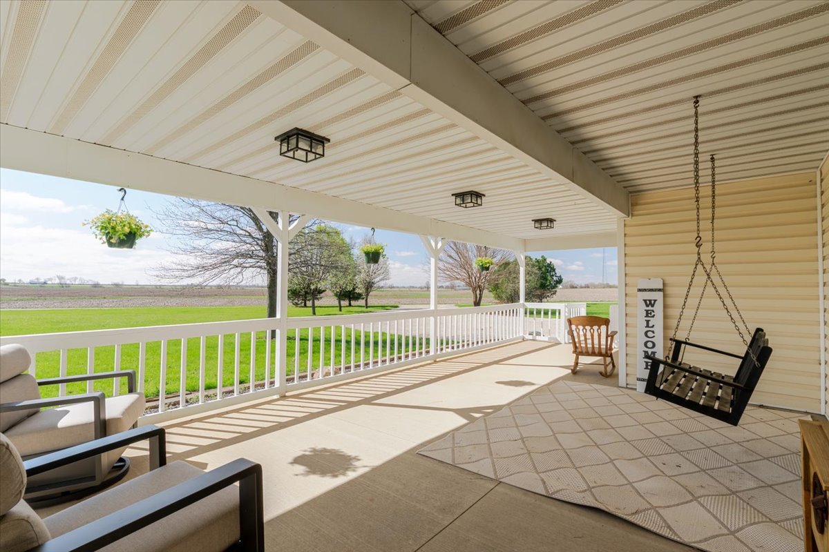 1388 East 2950 North Road Mansfield, IL 61854 - Photo 4 of 43 a view of a porch with furniture
