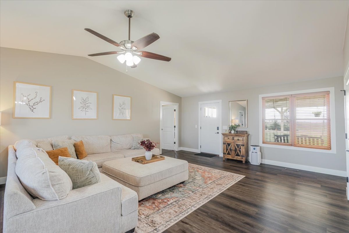 1388 East 2950 North Road Mansfield, IL 61854 - Photo 8 of 43 a living room with furniture and a large window