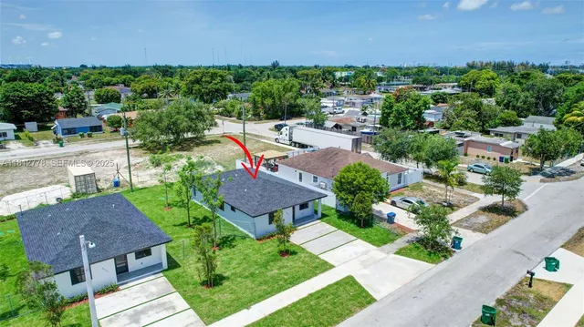 an aerial view of a house with a garden
