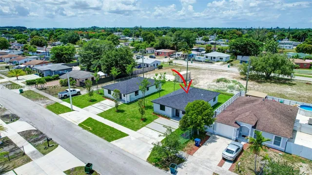 an aerial view of a house with a garden