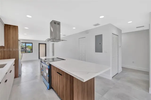 a kitchen that has a sink and a stove