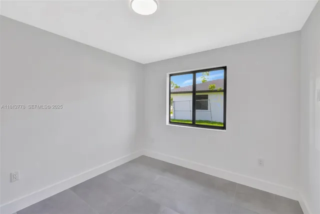 a view of a room with shelf on the wall