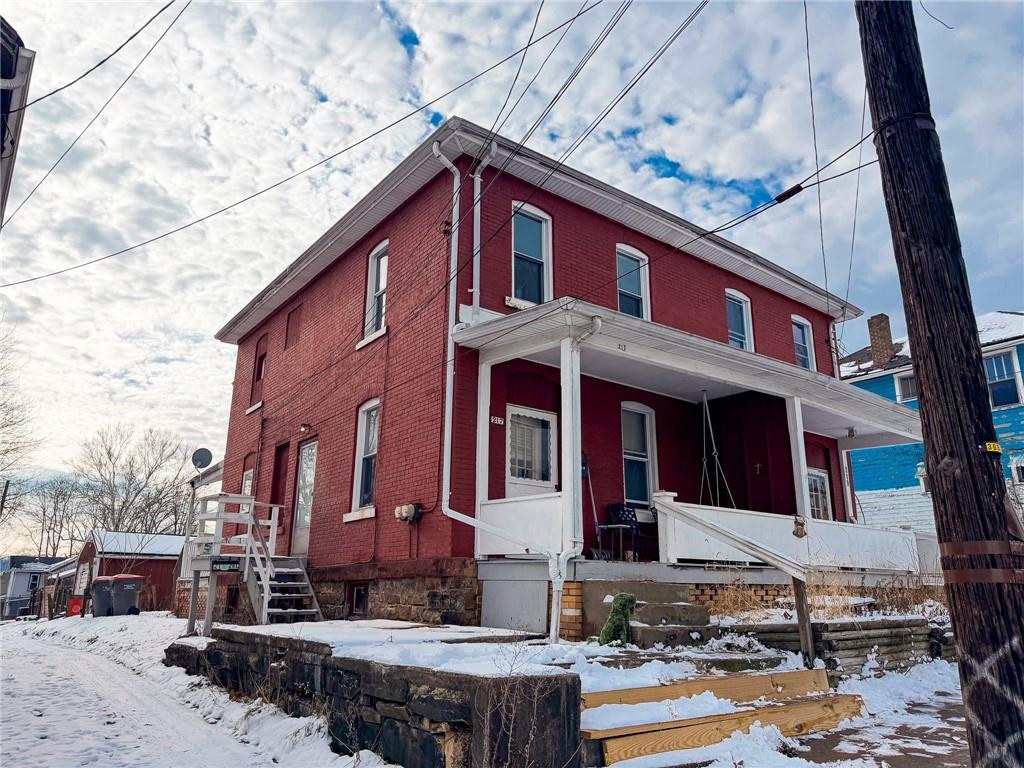 217 13th Street, Unit 2 Beaver Falls, PA 15010 - Photo 2 of 9 a view of a brick building with many windows