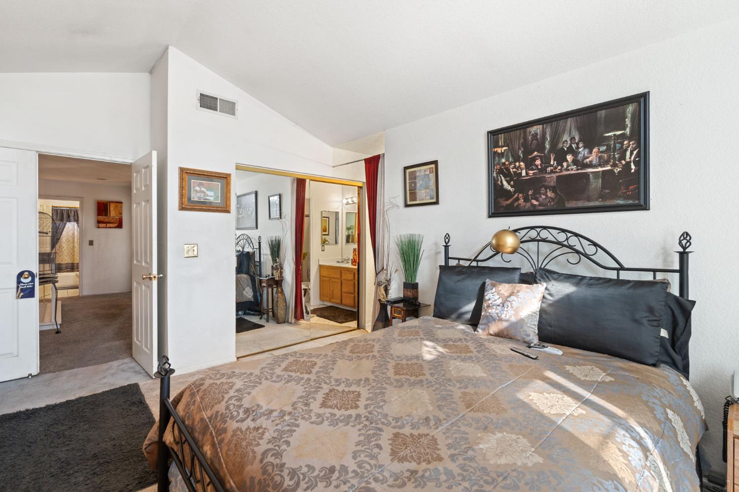 3941 Grey Livery Way Antelope, CA 95843 - Photo 15 of 28 a bedroom with a bed and a large mirror