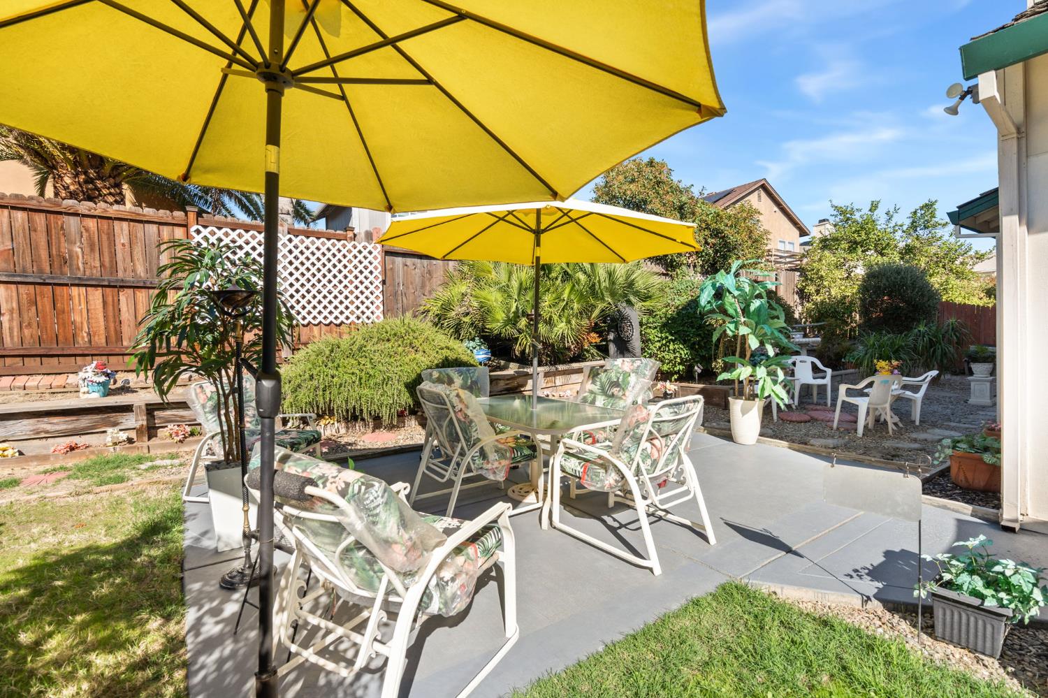 3941 Grey Livery Way Antelope, CA 95843 - Photo 26 of 28 a view of a patio with a table and chairs under an umbrella