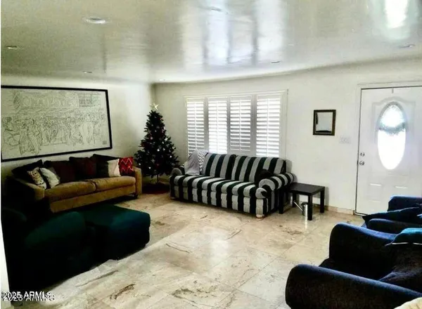 a bed room with a bed and glass windows