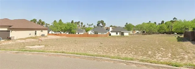 a view of a road with a building in the background