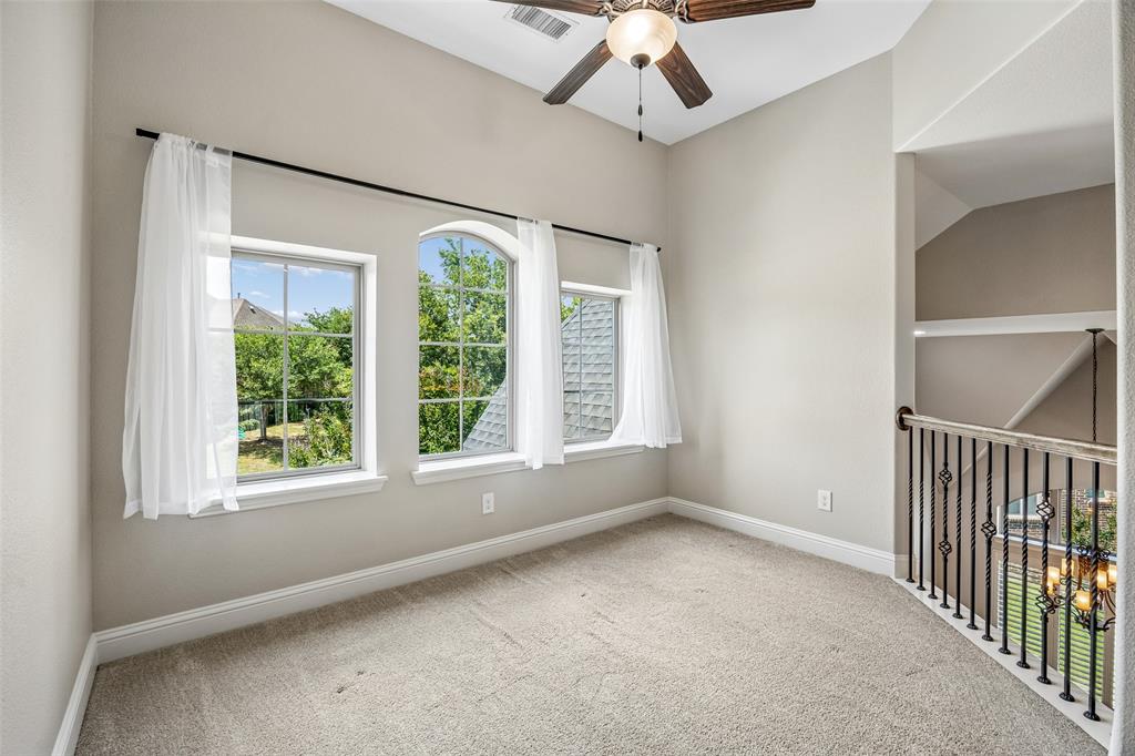 134 Santa Rosa Way Irving, TX 75062 - Photo 20 of 26 Bright upstairs living area with abundant natural light and flexible space for a study nook, lounge, or play area.