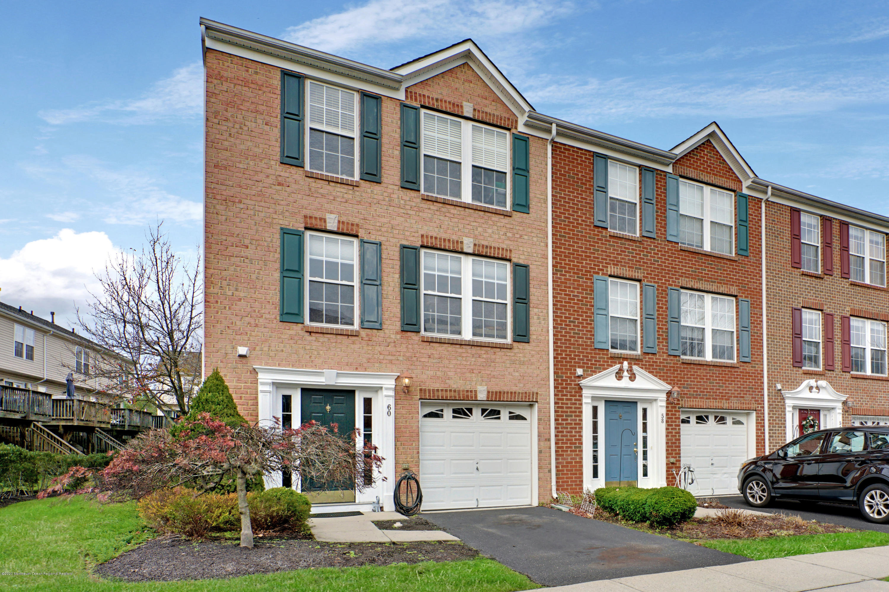60 Saxton Road, Unit 87 Farmingdale, NJ 07727 - Photo 1 of 38 a front view of a house with yard and green space