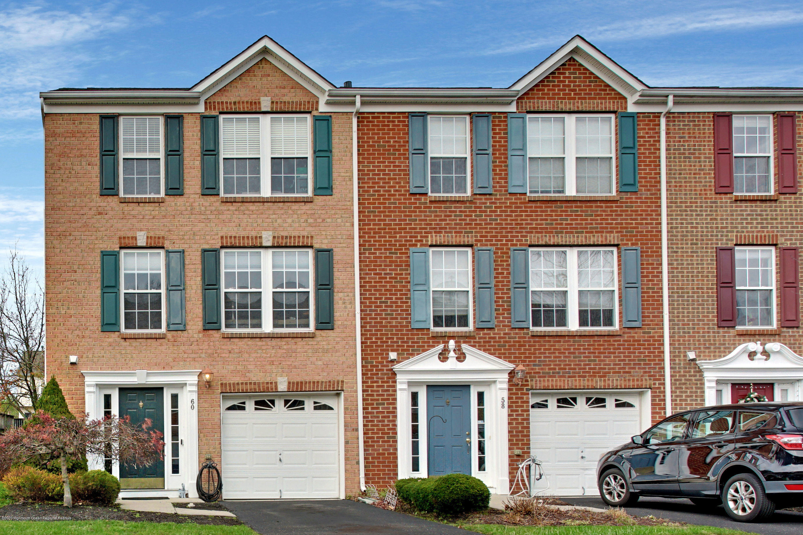 60 Saxton Road, Unit 87 Farmingdale, NJ 07727 - Photo 2 of 38 a front view of a residential apartment building with a yard